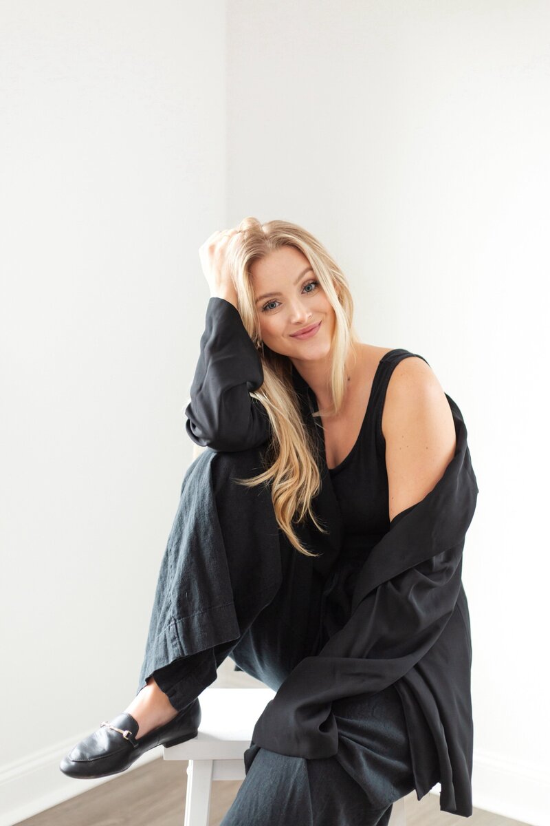 Portrait of Macey Johnson, smiling and relaxed, representing the creative force behind the online experiences curated for hospitality brands