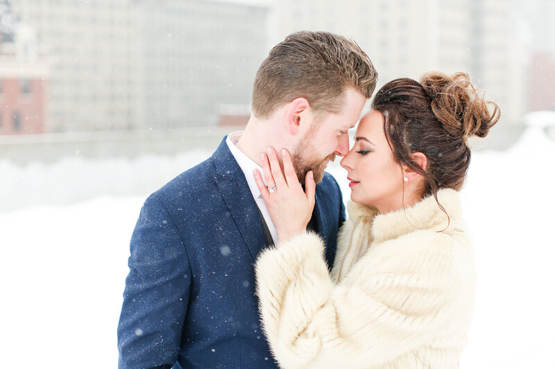 Boise Wedding Videographer capturing a romantic moment between a bride and groom in the snow.