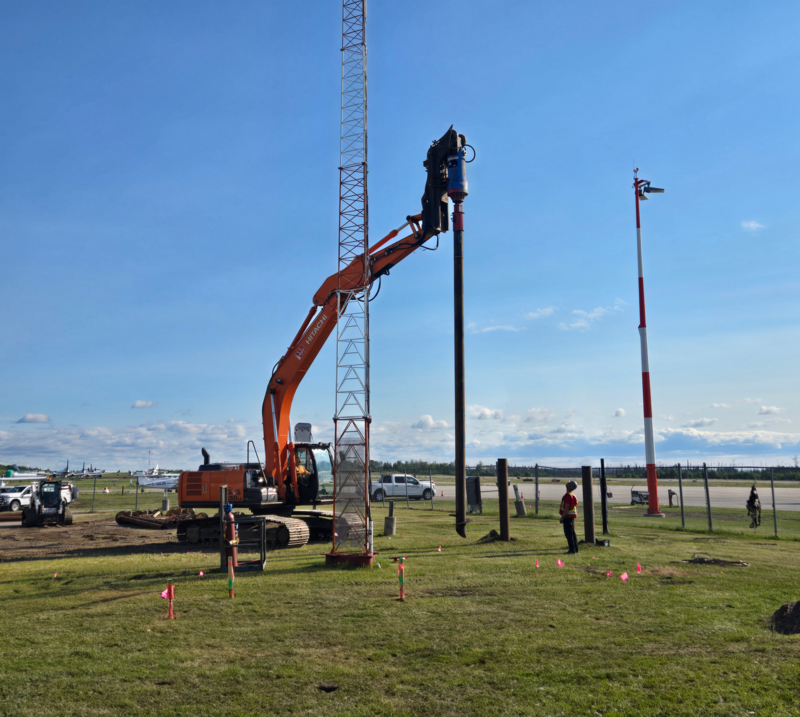 Helical screw pile being installed