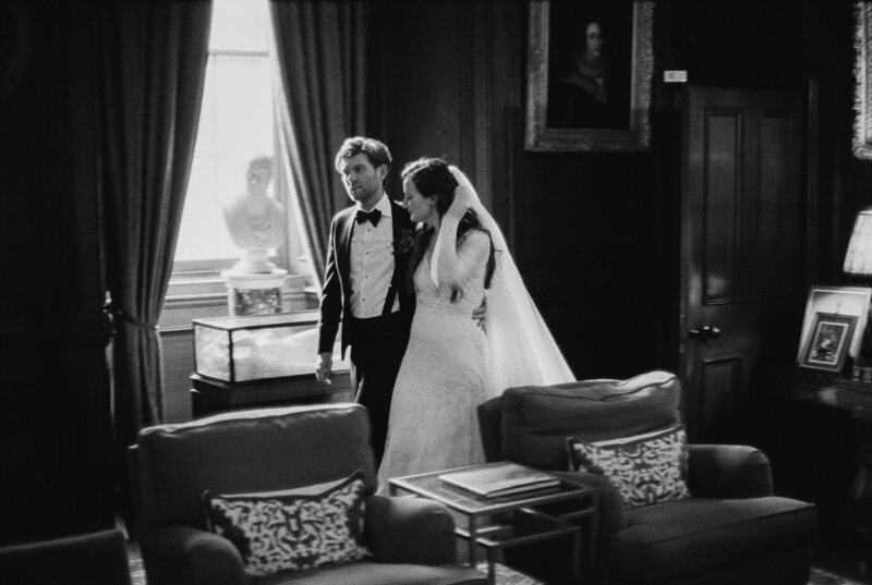 bride and groom walking through a room