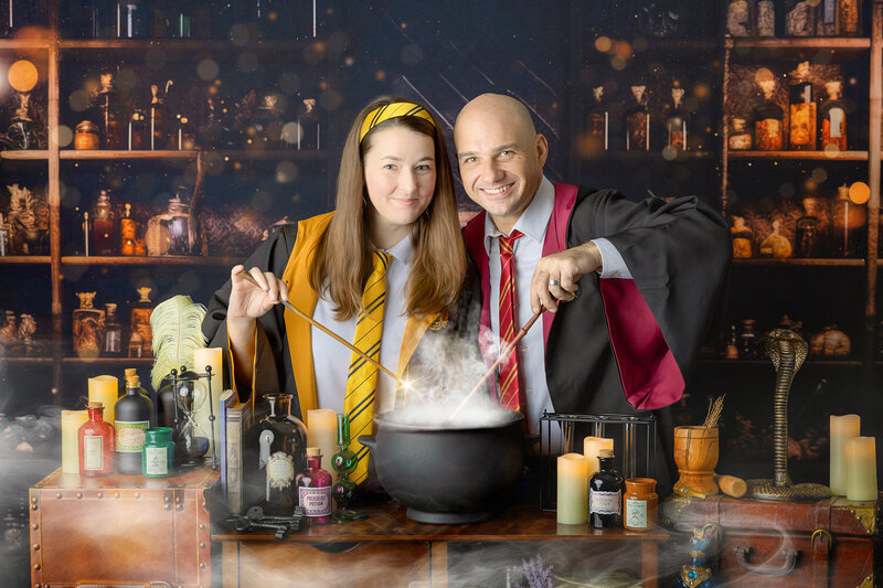 Two siblings make magic in a cauldron at the Wizarding School Portrait event in Myrtle Beach, SC