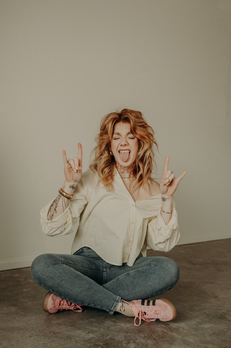 A pregnant mother sitting in Land Studio midland with her toddler daughter sitting on her lap. 