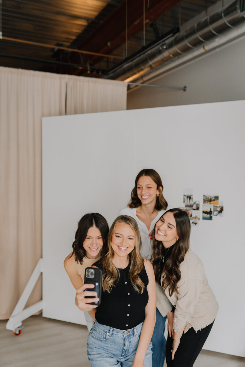 Megan and her team taking a selfie together
