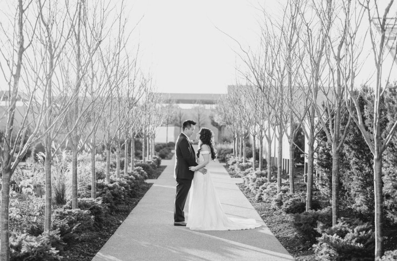 A bride and groom at Fredrick Meijer Gardens  on a pathway