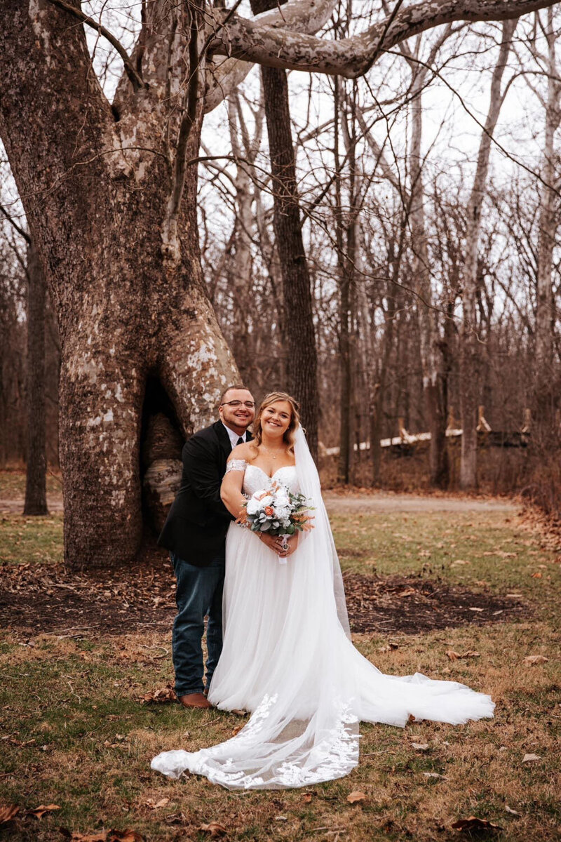 Bride and groom kissing during their wedding ceremony exit