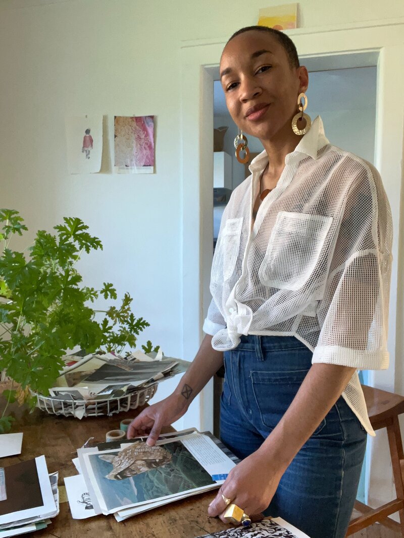 Image of Michaela at her table with the collage kits