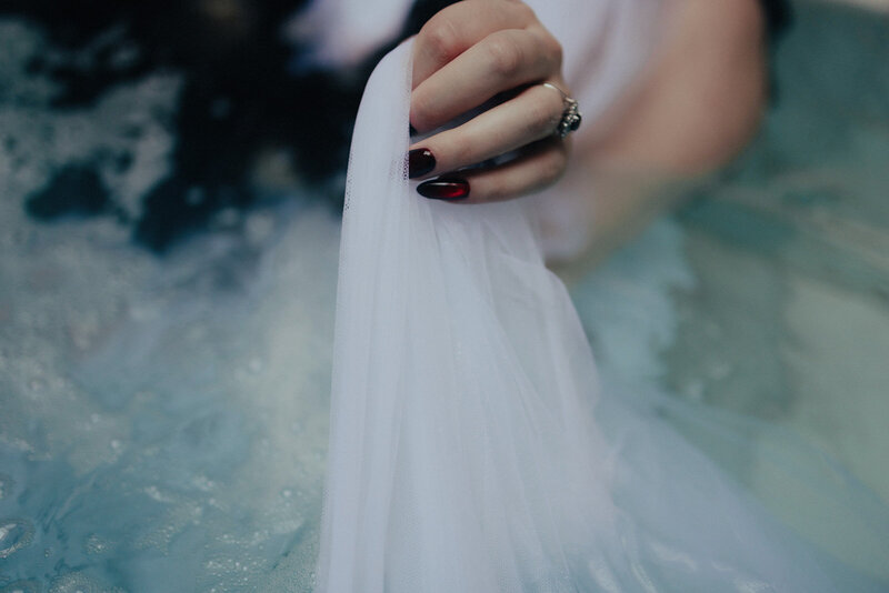 Historic first-ever wedding at any AIRE Ancient Baths location, featuring bride and groom in steamy candlelit pool in Chicago, captured by Bradi Potter