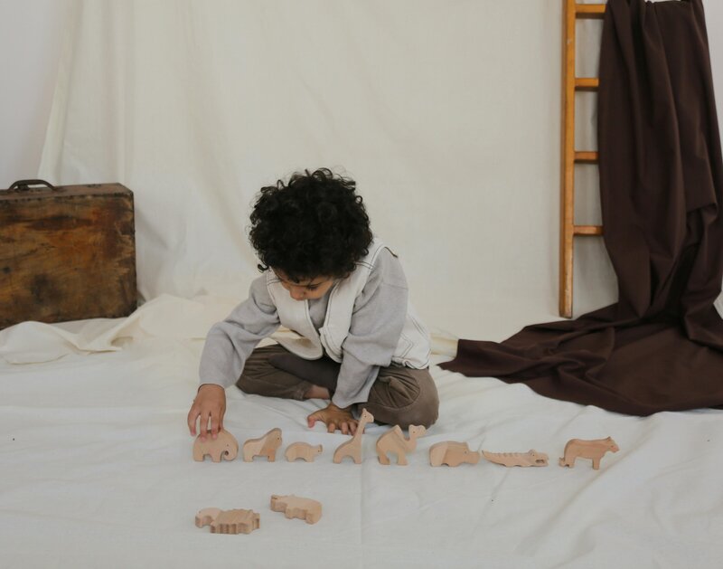 Children interacting in sensory play area with blocks and toys