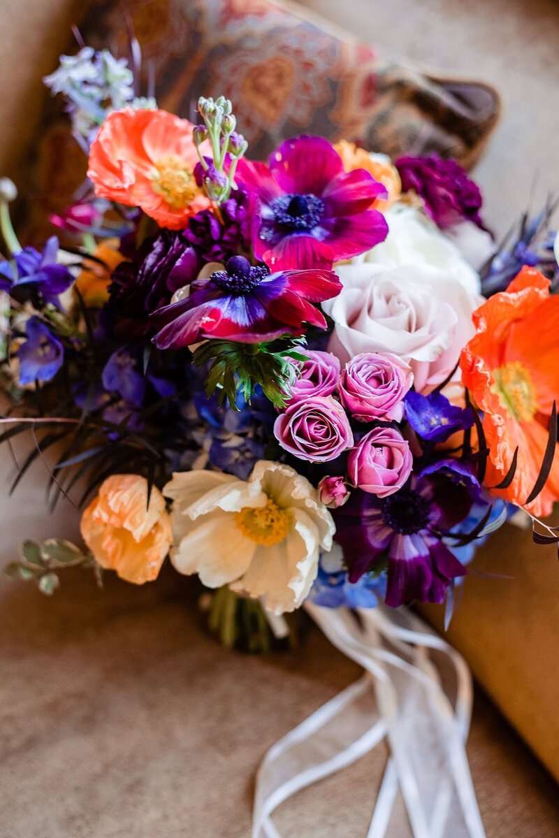 Vibrant purple, pink, orange, blue and yellow  flower heavy bouquet