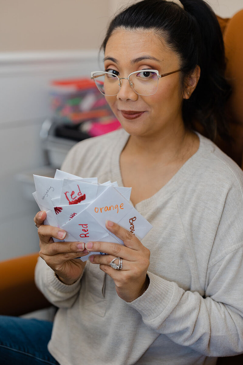 Woman showing game during branding photos in Ashburn, Virginia