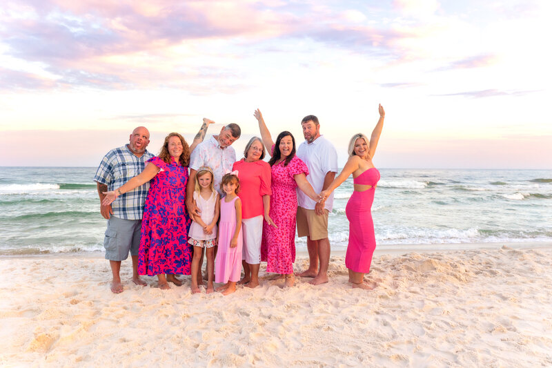 Candid moment of a family with pretty sunset over the water