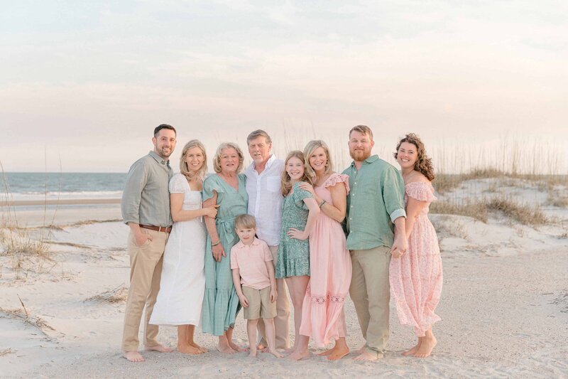 Mom and Dad are candidly playing with their toddler son and baby girl under the majestic oaks at Montage Palmetto Bluff, Bluffton, SC for Hilton Head Family Photographer Lamp and Light Photography.