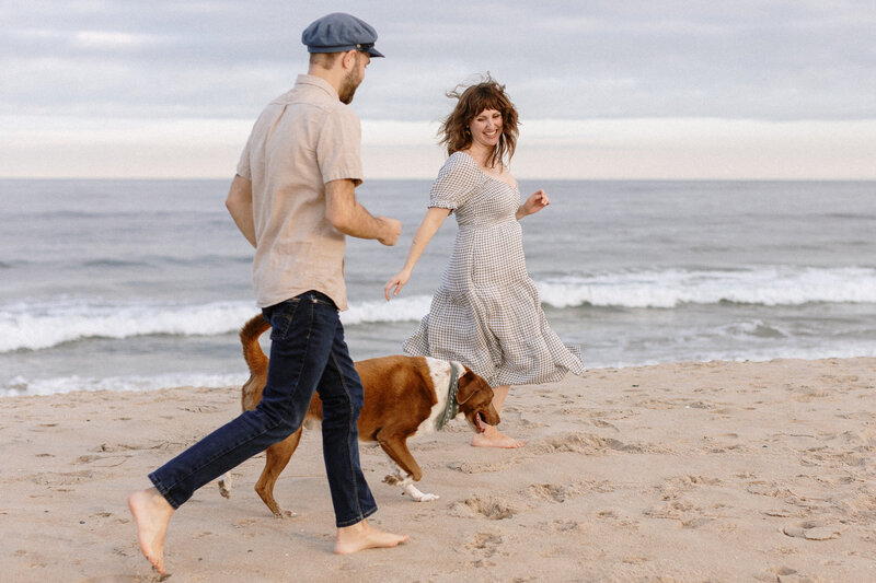 couple running with dog in asbury park nj