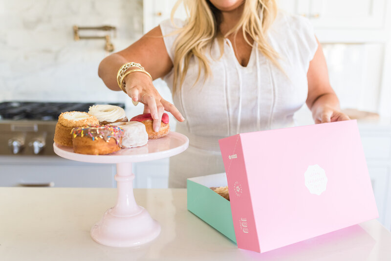 Erynn placing donuts on stand