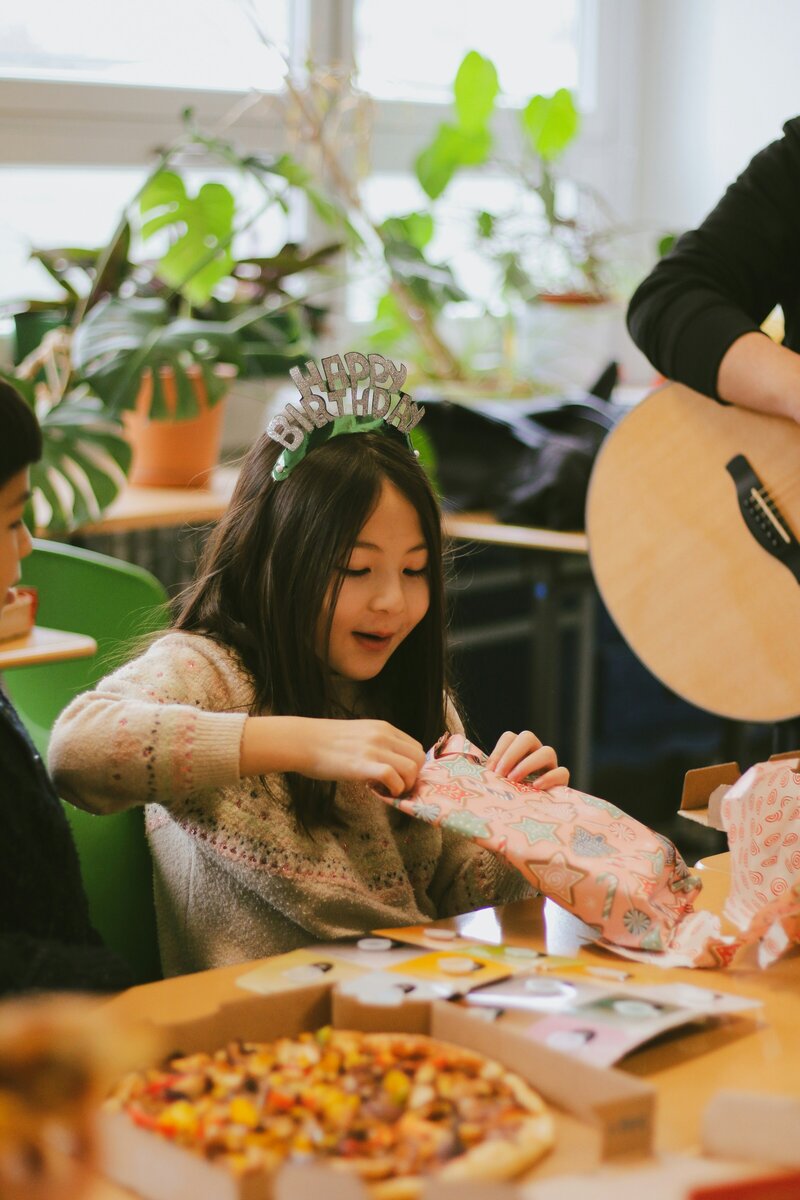 Parents and children enjoying a birthday party in the café space