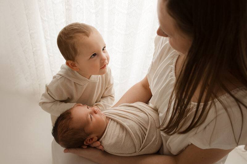 6 month old baby sitting up during her photography session in my Tucson photography studio