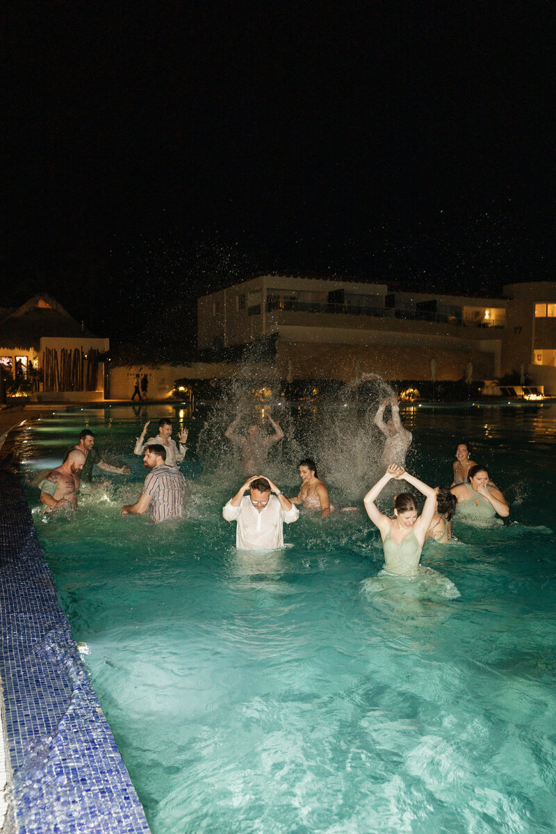 bridal party jumping in pool at destination wedding, Dreams Dominicus La Romana Resort in Punta Cana, Dominican Republic
