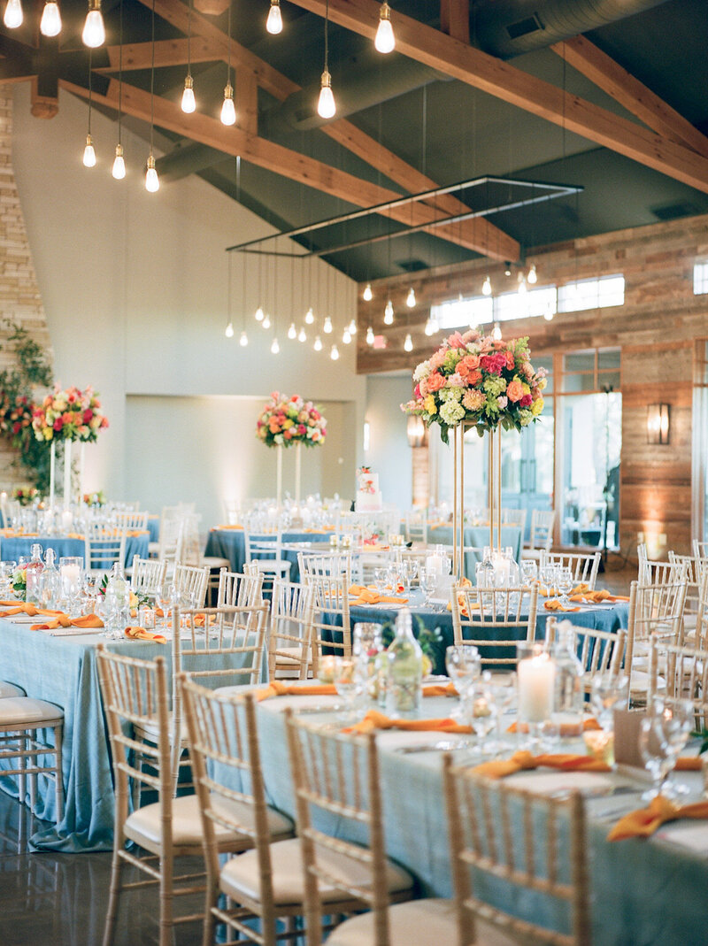 Reception decor in Canyonwood Ridge hall with romantic lighting and Hill Country details