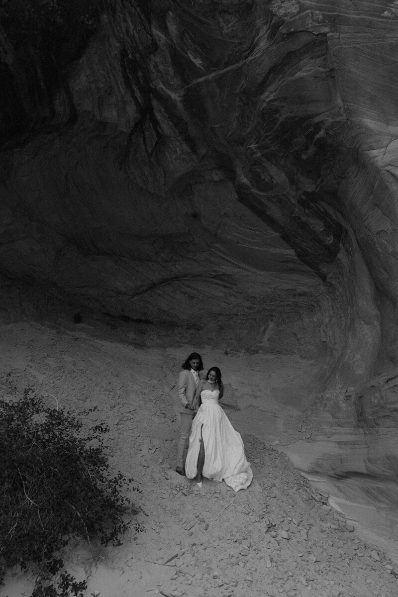 bride and groom tucked away in canyon corner