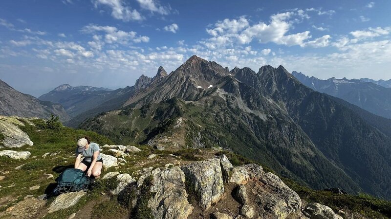 hiking elopement location, a hike in the north cascades with a woman packing her backpack