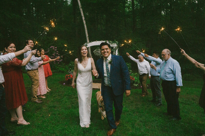 The groom and bride are walking and holding hands.