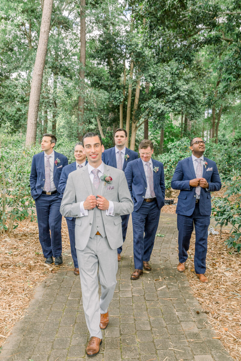 groom and groomsmen portrait in the forest