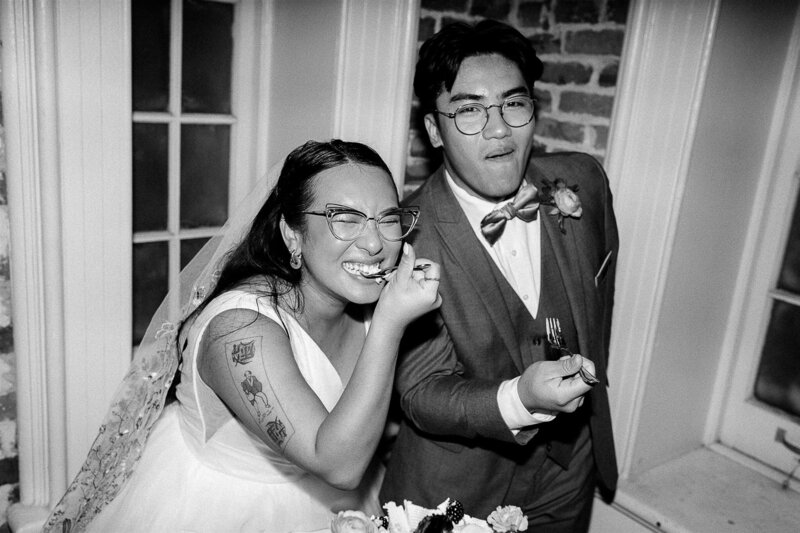 Van and Cindy smile while eating cake.