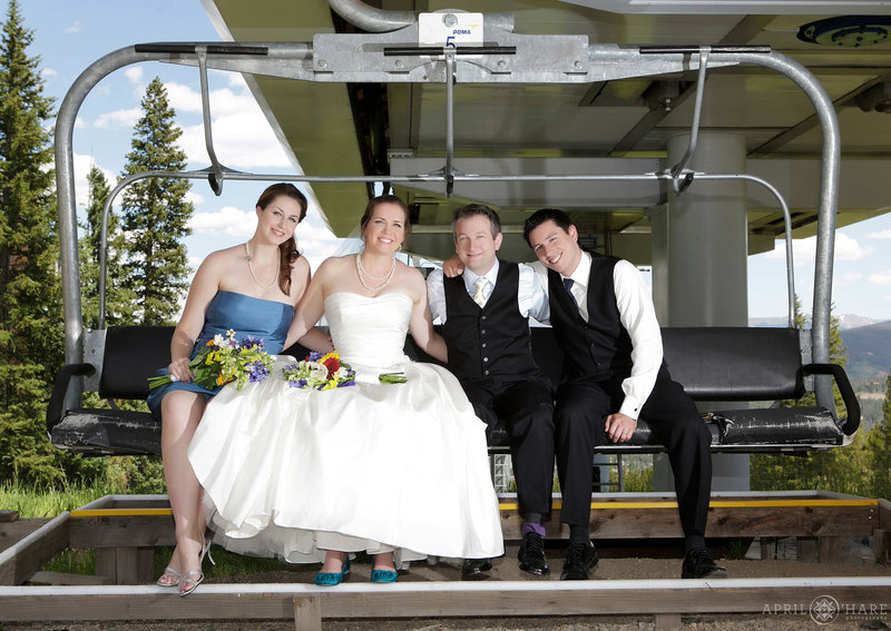 Cute ski lift wedding party portrait at Ten Mile Station in Breckenridge Colorado