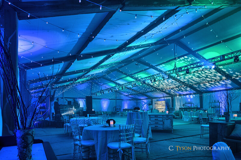 Elegant indoor event tent with uplighting and DJ-ready setup by Charizma Entertainment