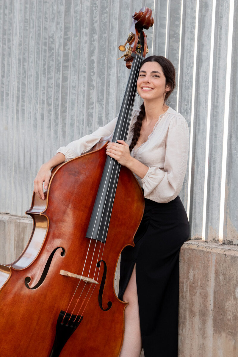 Smiling woman with her cello