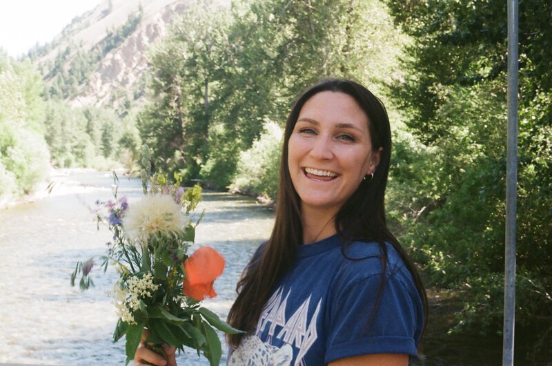 jenna-smiling-with-flowers-about
