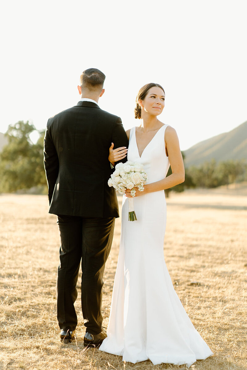 couple hugging in front of rocky landscape