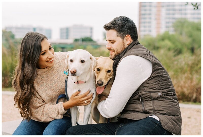 cute engaged couple with dogs in downtown Houston