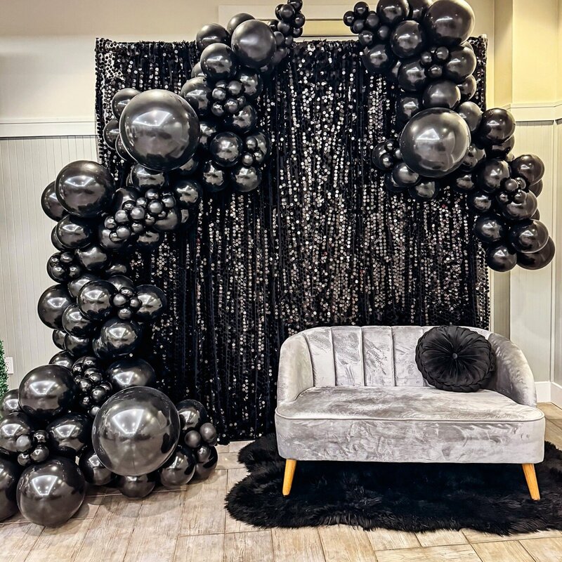 black shimmer wall with black balloons for coporate event in Tampa
