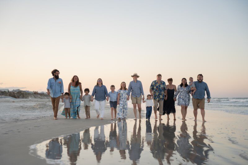Family-walking-along-the-beach