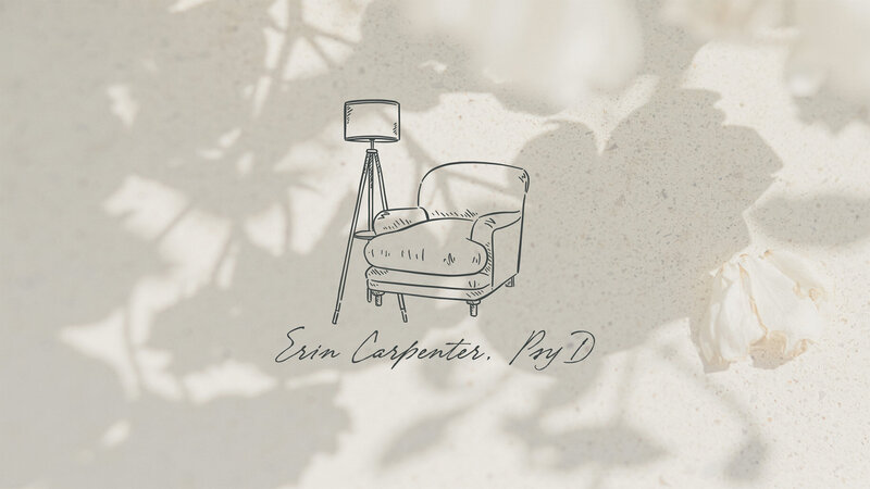 A dark blue logo for a therapist showcasing a cozy chair and floor lamp.