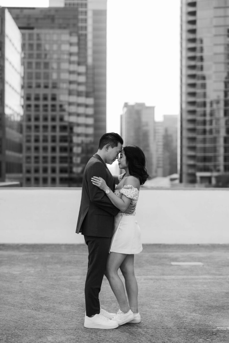black and white image of a couple nose-to-nose at Downtown Austin Rooftop
