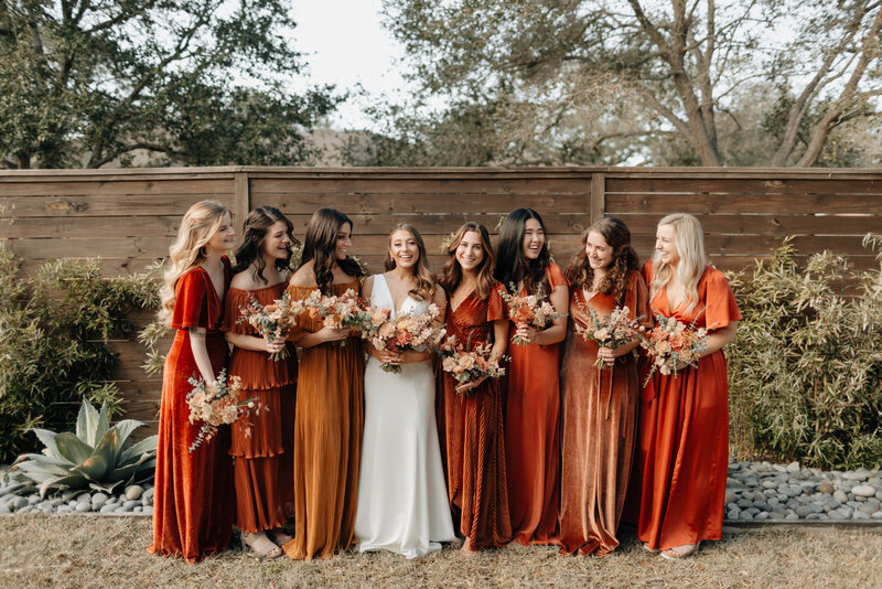 Bridesmaids in rust dresses