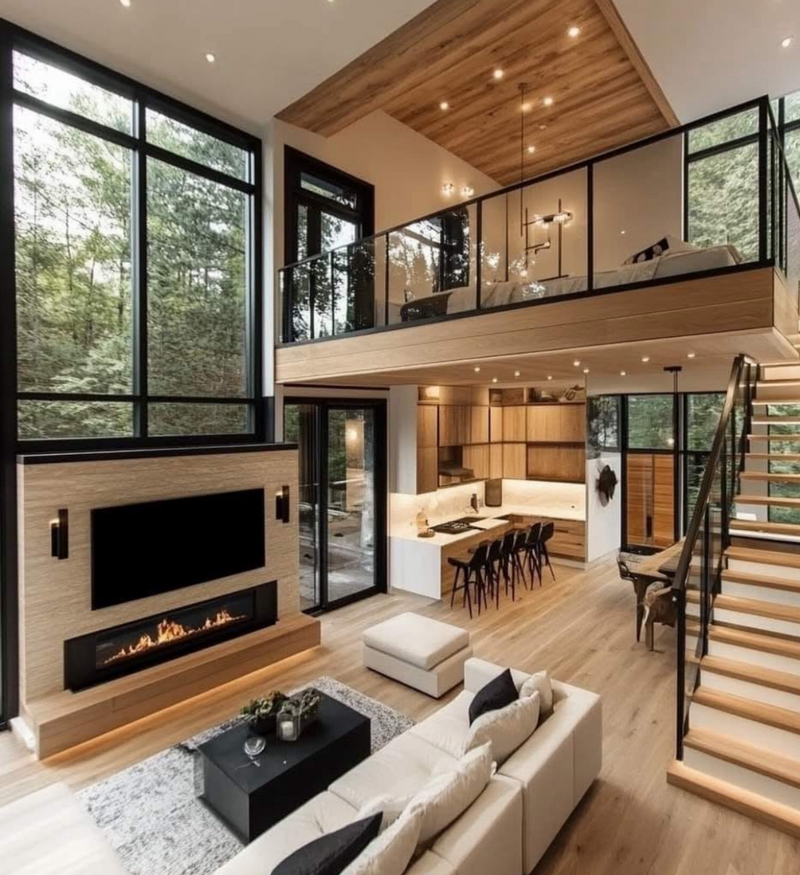 A light and airy modern living room in a home in the suburbs of Philadelphia featuring a built in glass fireplace, high ceilings, wood accents, and an open concept living space.