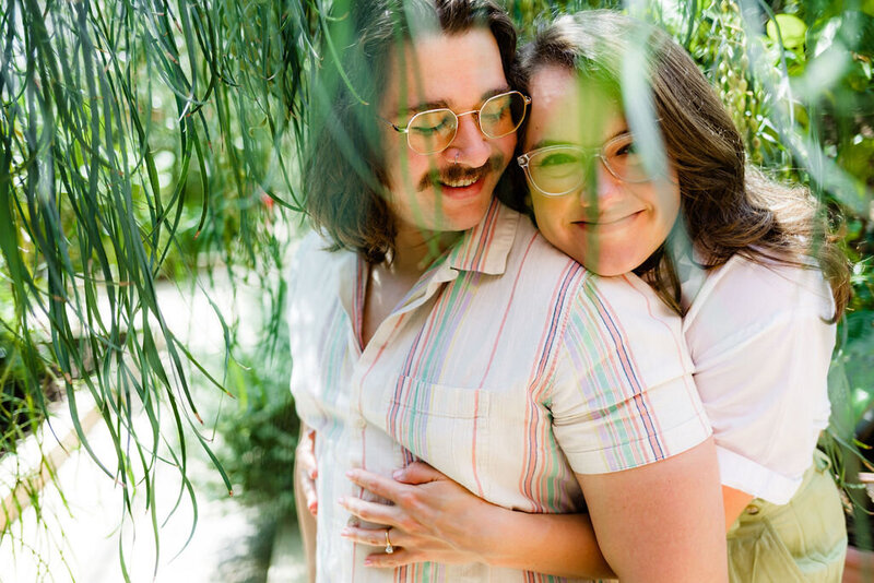 A person hugging their partner from behind