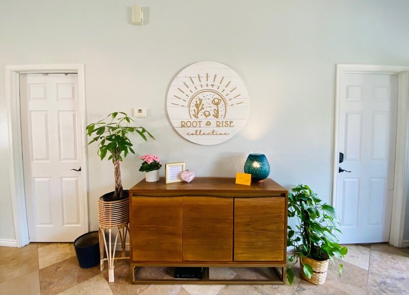 Cherry Blossom Doulas office in Phoenix with white desk and a beige couch