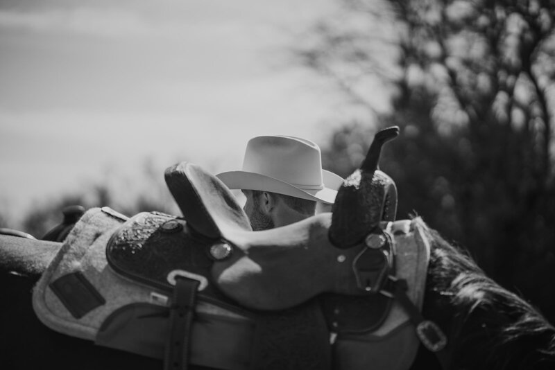 A cowboy poses with his horse for a portrait session in Tennessee.