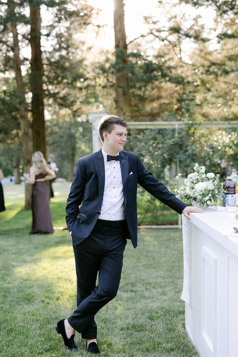 groom-cocktail-hour-white-bar
