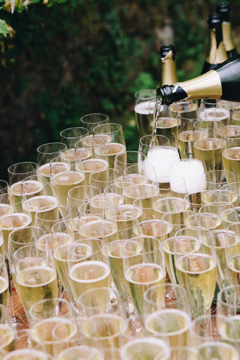 Champagne flutes on outdoor table at party