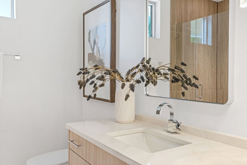 wood and white modern bathroom design by Gracious Home Interiors