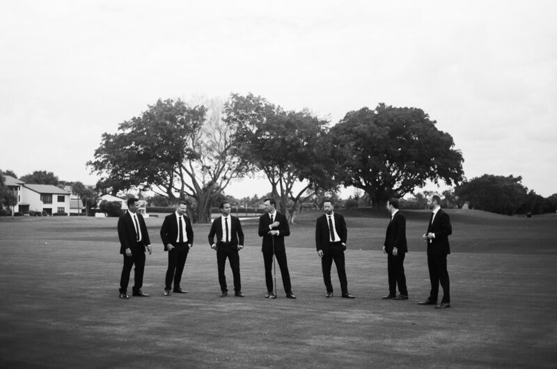 groomsmen candid photo by naples florida wedding photographer