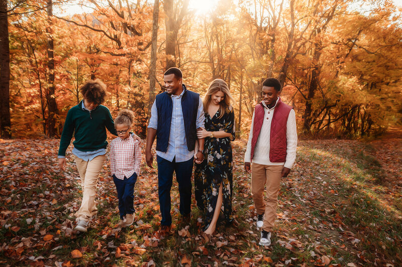 Family walks along the Blue Ridge Parkway during their Family Photos in Asheville, NC.