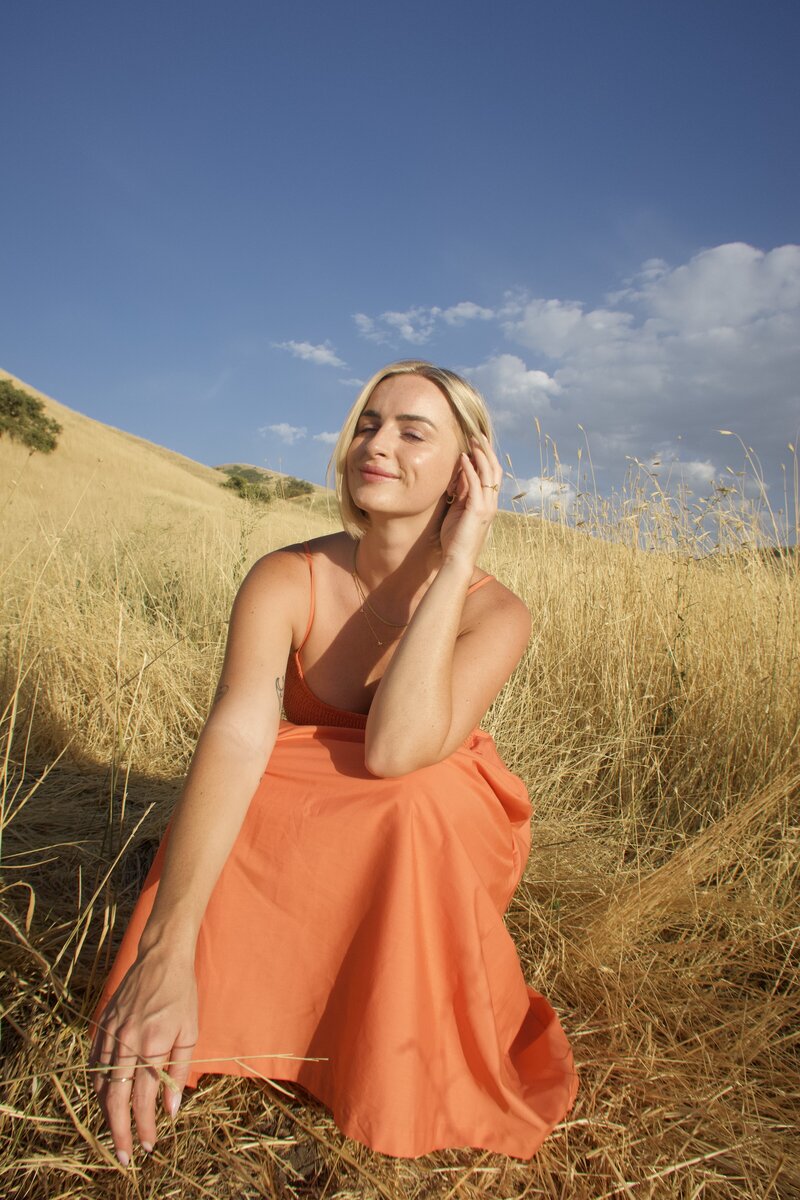 Jaiden standing and holding telephone