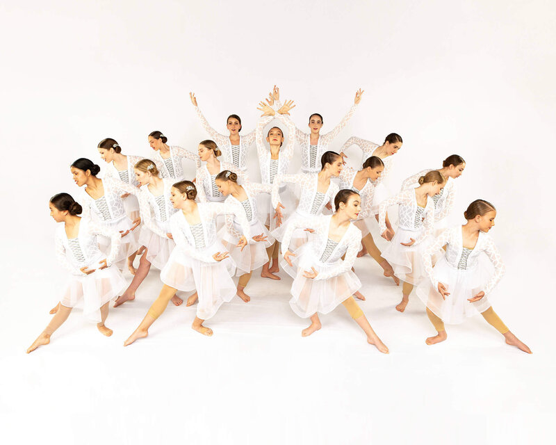 Dancers in white in Dallas performing arts studio