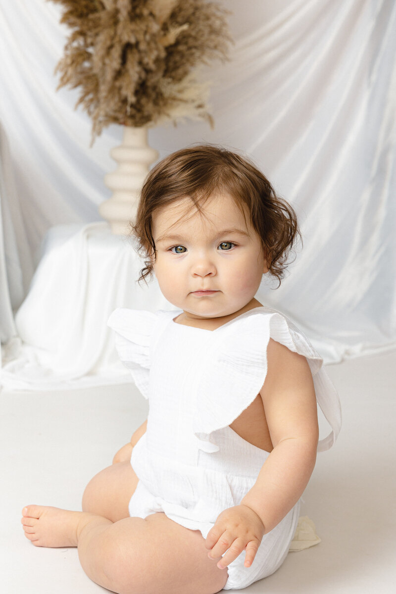 Toddler photographed at home on the pop-up studio.